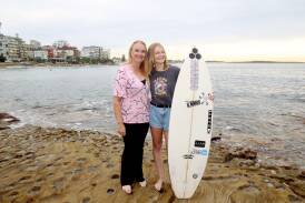 Surfer April Davey, 20, with her mother Danielle. Picture by Chris Lane